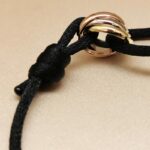 Cartier Trinity bracelet, small model, 18k tri-colour gold, black cord - Image 4